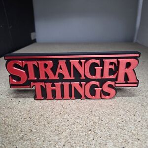 Red Logo Desk Sign - Official TV Series Decor